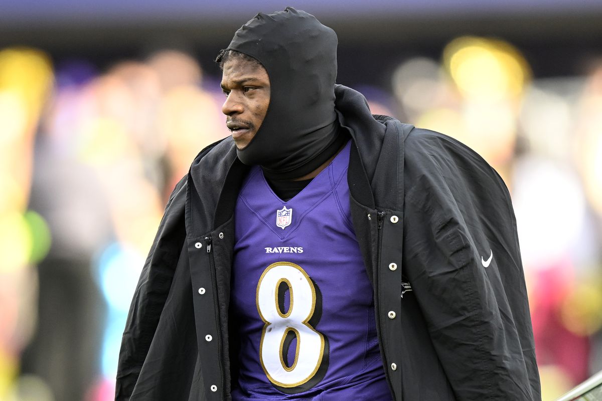 Lamar Jackson #8 of the Baltimore Ravens watches the game against the Denver Broncos at M&amp;T Bank Stadium on December 04, 2022 in Baltimore, Maryland.