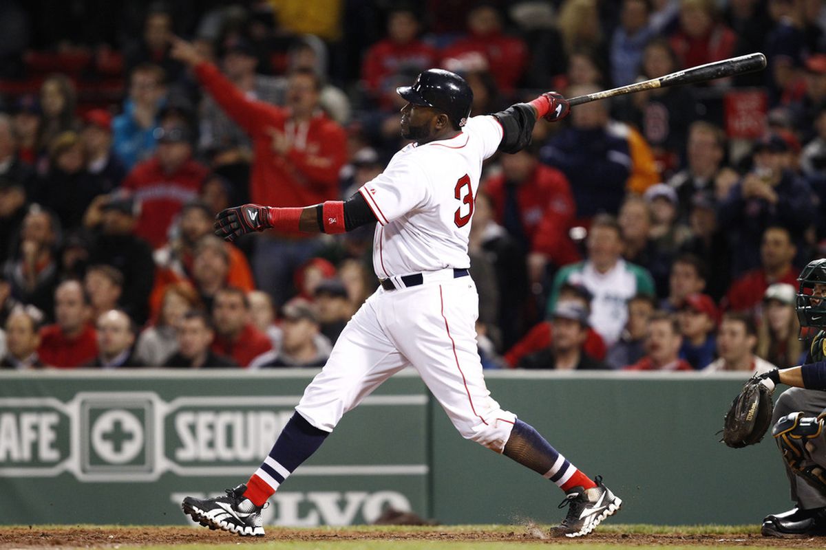 Boston, MA, USA; Boston Red Sox designated hitter David Ortiz (34) hits a double against the Oakland Athletics during the eighth inning at Fenway Park.  Mandatory Credit: Mark L. Baer-US PRESSWIRE