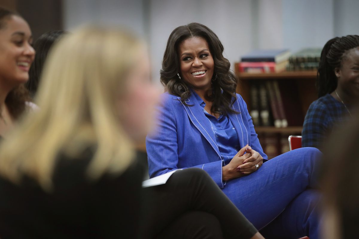 Michelle Obama Reads From Her Book To Girls From Her Old High School In Chicago