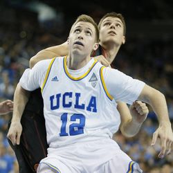 UCLA's David Wear boxes out Southern California's Nikola Jovanovic, of Serbia, during the first half of an NCAA college basketball game, Sunday, Jan. 5, 2014, in Los Angeles. (AP Photo/Danny Moloshok)