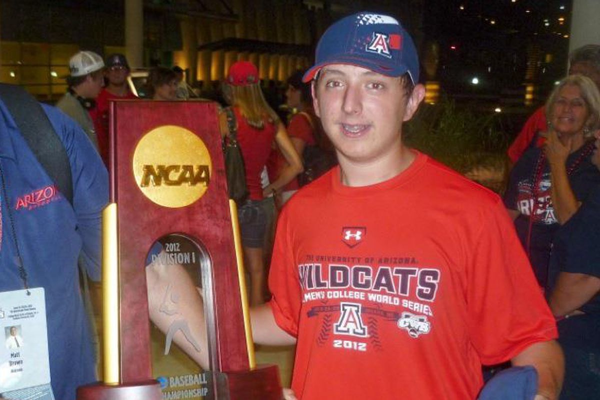 Ezra Amacher with the Arizona Wildcats' 2012 NCAA baseball championship trophy