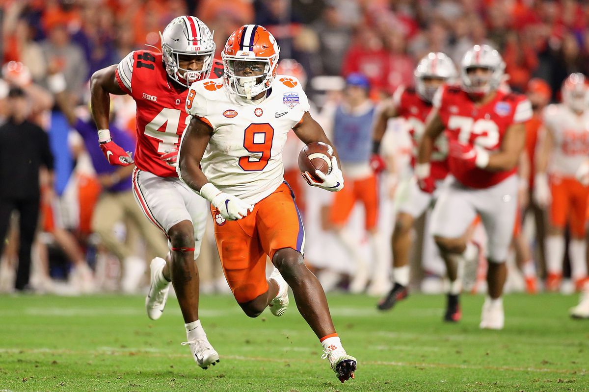 Running back Travis Etienne of the Clemson Tigers rushes the football against the Ohio State Buckeyes during the PlayStation Fiesta Bowl at State Farm Stadium on December 28, 2019 in Glendale, Arizona.