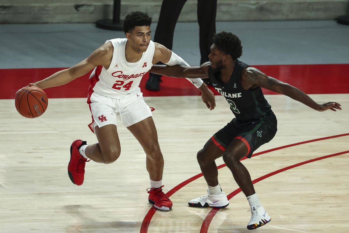 Houston Cougars guard Quentin Grimes dribbles the ball against Tulane Green Wave guard Jordan Walker during the first half at Fertitta Center.&nbsp;