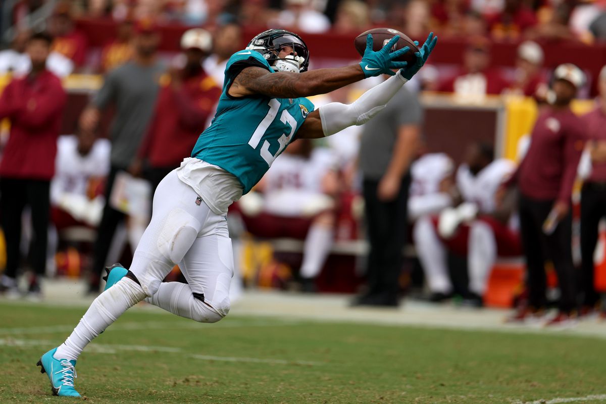 Wide receiver Christian Kirk #13 of the Jacksonville Jaguars catches a second half pass against the Washington Commanders at FedExField on September 11, 2022 in Landover, Maryland.