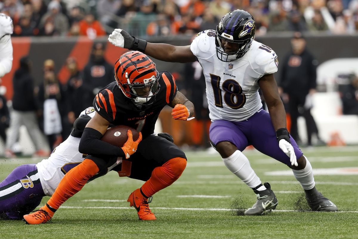 Roquan Smith #18 of the Baltimore Ravens tackles Ja’Marr Chase #1 of the Cincinnati Bengals during the game at Paycor Stadium on January 8, 2023 in Cincinnati, Ohio.