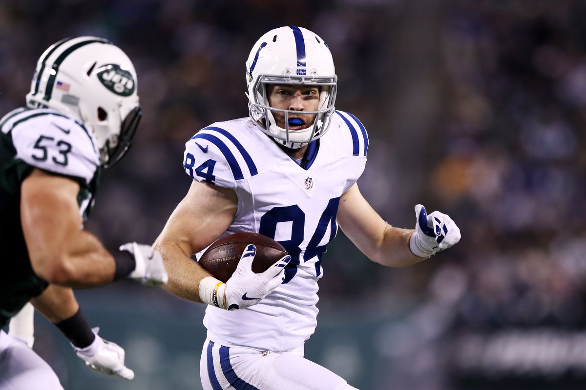Jack Doyle of the Indianapolis Colts carries the ball against the New York Jets in the first half during their game at MetLife Stadium on December 5, 2016 in East Rutherford, New Jersey.