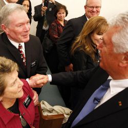 President Dieter F. Uchtdorf, right, second counselor in the First Presidency of The Church of Jesus Christ of Latter-day Saints, greets Elder Gary Bole, above, and Sister Irene Bole, below, at a fireside for the Salt Lake Inner City Mission in Salt Lake City, Friday, Dec. 4, 2015.