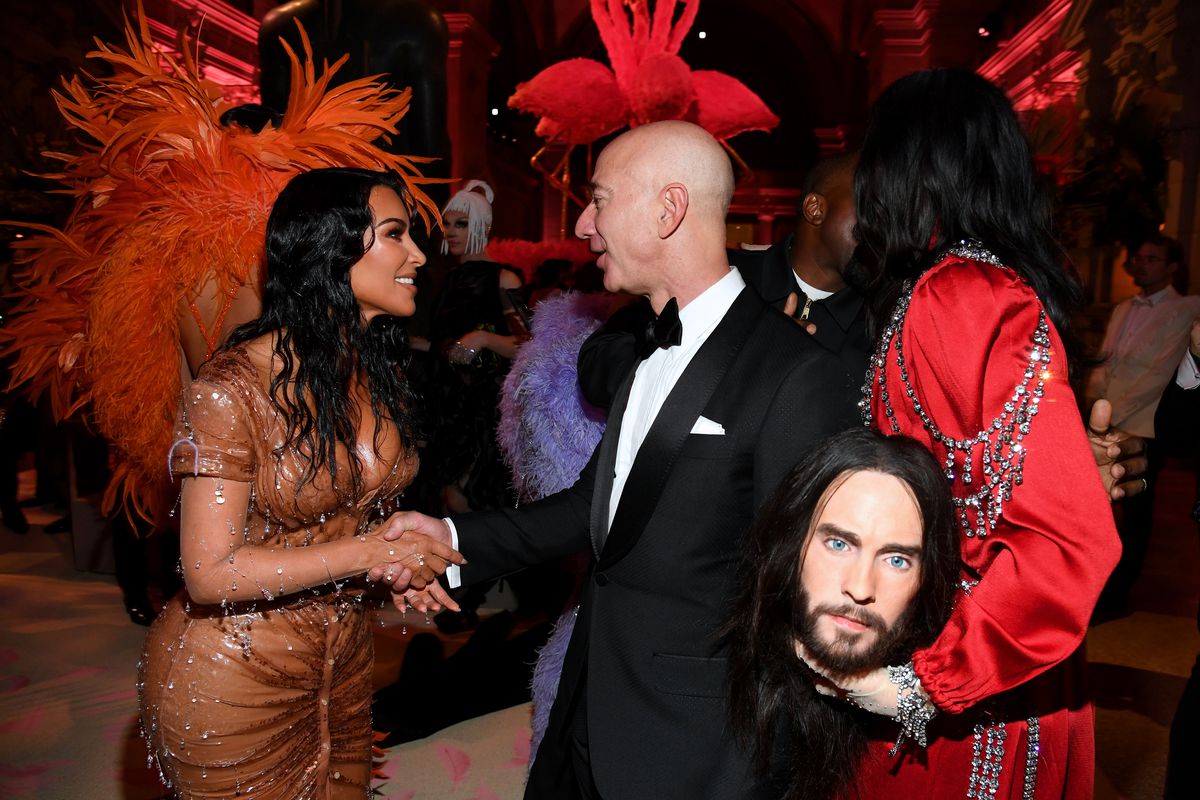 Jeff Bezos shaking hands with Kim Kardashian West.