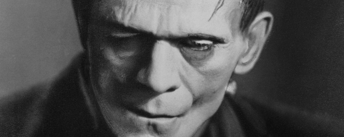 A black-and-white close-up portrait of Boris Karloff’s face made up as Frankenstein’s nameless monster from the 1931 film adaptation of Mary Shelley’s book