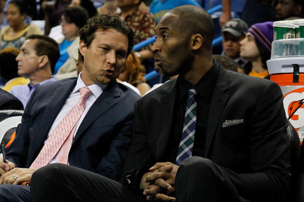 April 9, 2012; New Orleans, LA, USA; Los Angeles Lakers shooting guard Kobe Bryant (right) talks with assistant coach Quin Snyder (left) against the New Orleans Hornets at the New Orleans Arena. The Lakers defeated the Hornets 93-91.