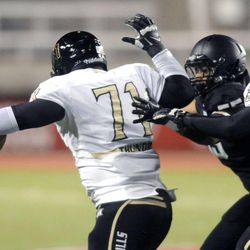 Desert Hills defensive lineman Lausi'i Sewell fights for yardage after making an interception during the 3AA State Championships at Rice-Eccles Stadium on Friday, November 22, 2013.