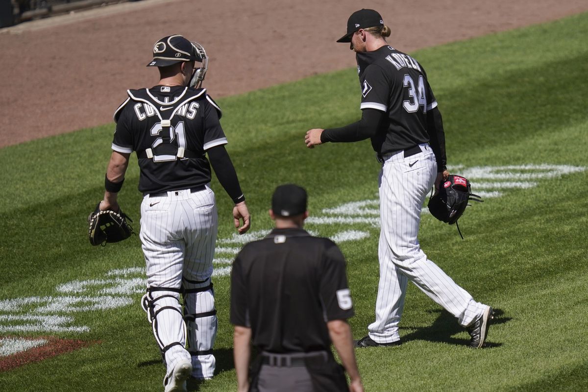 Michael Kopech hops off the field as catcher Zack Collins comes to his aid during a game last week. 