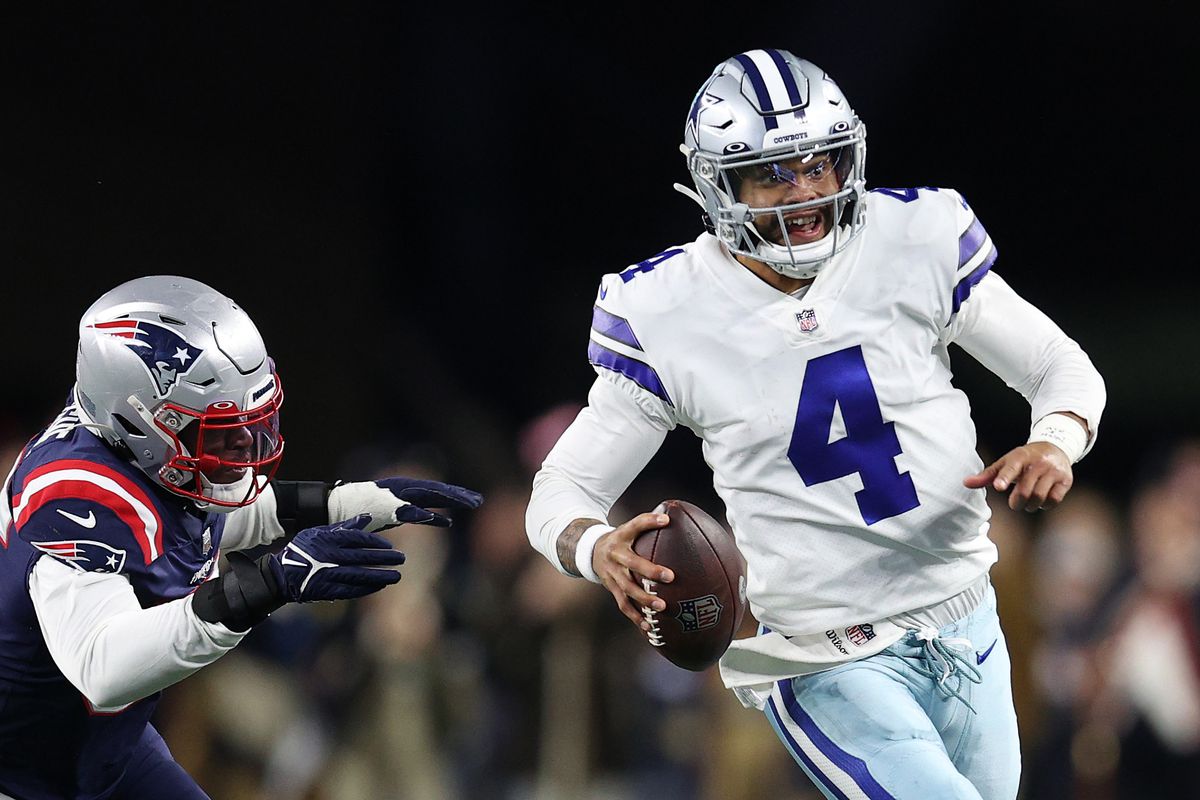 OCTOBER 17: Dak Prescott #4 of the Dallas Cowboys scrambles with the ball in the fourth quarter against the New England Patriots at Gillette Stadium on October 17, 2021 in Foxborough, Massachusetts.