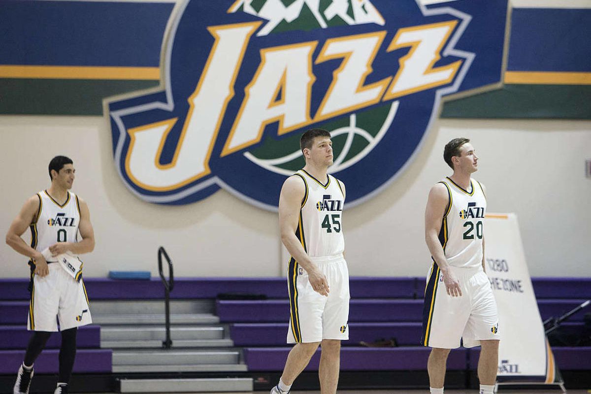 Utah Jazz players Enes Kanter, Jack Cooley, and Gordon Hayward walk out for media day Monday, Sept. 29, 2014, in Salt Lake City at the Zions Bank basketball center.