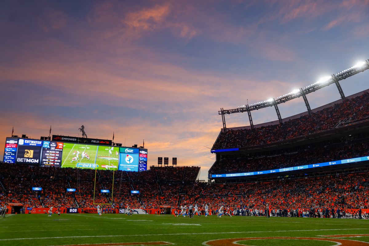 A general view of the stadium as the sun sets over the stadium during the second half of a game between the Denver Broncos and the Los Angeles Chargers at Empower Field at Mile High on November 28, 2021 in Denver, Colorado.