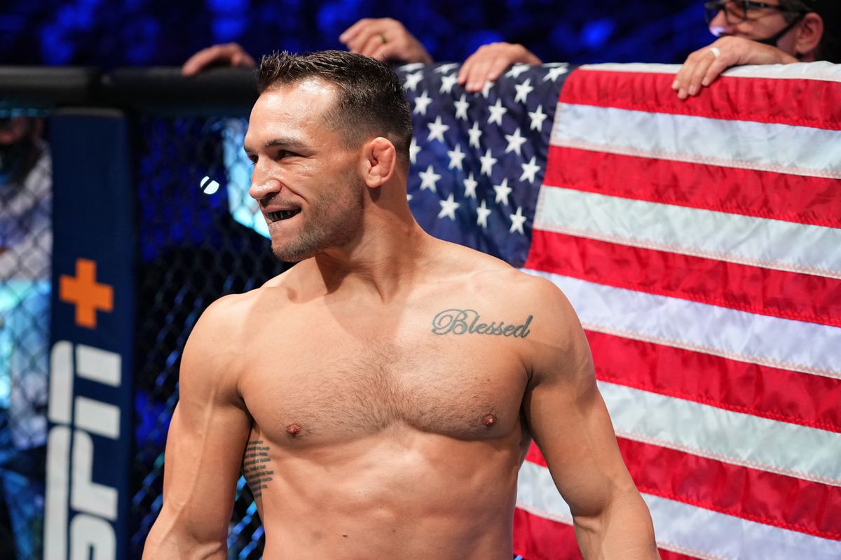 Michael Chandler poses ahead of his bout against Charles Oliveira at UFC 262