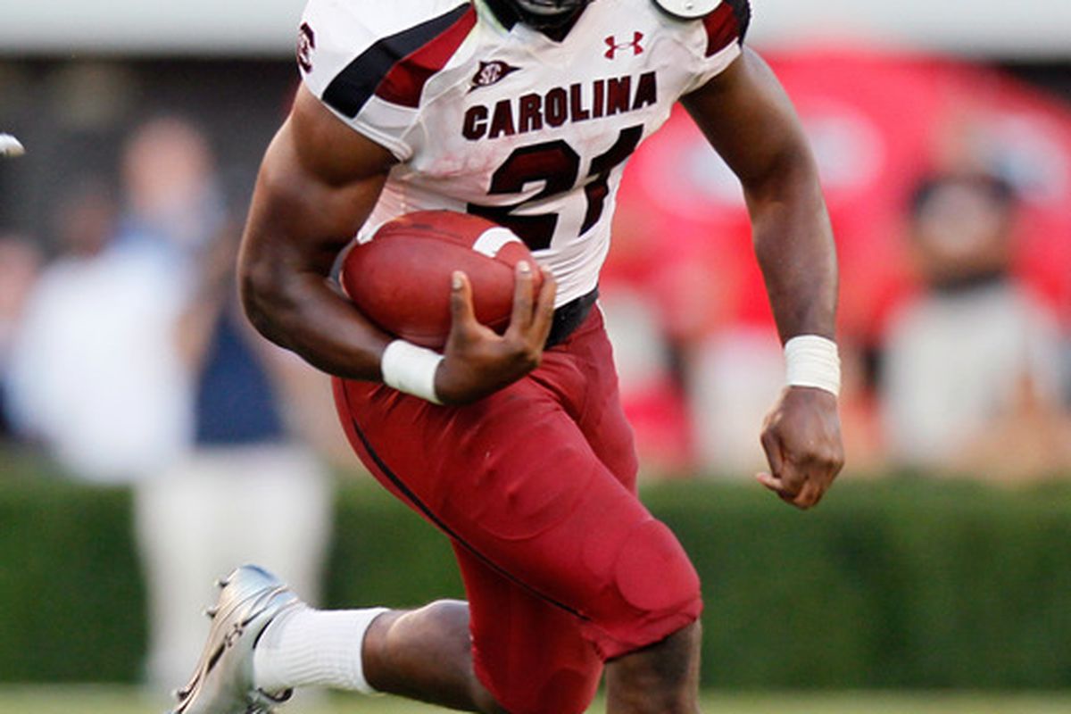 ATHENS, GA - SEPTEMBER 10:  Marcus Lattimore #21 of the South Carolina Gamecocks rushes upfield against the Georgia Bulldogs at Sanford Stadium on September 10, 2011 in Athens, Georgia.  (Photo by Kevin C. Cox/Getty Images)