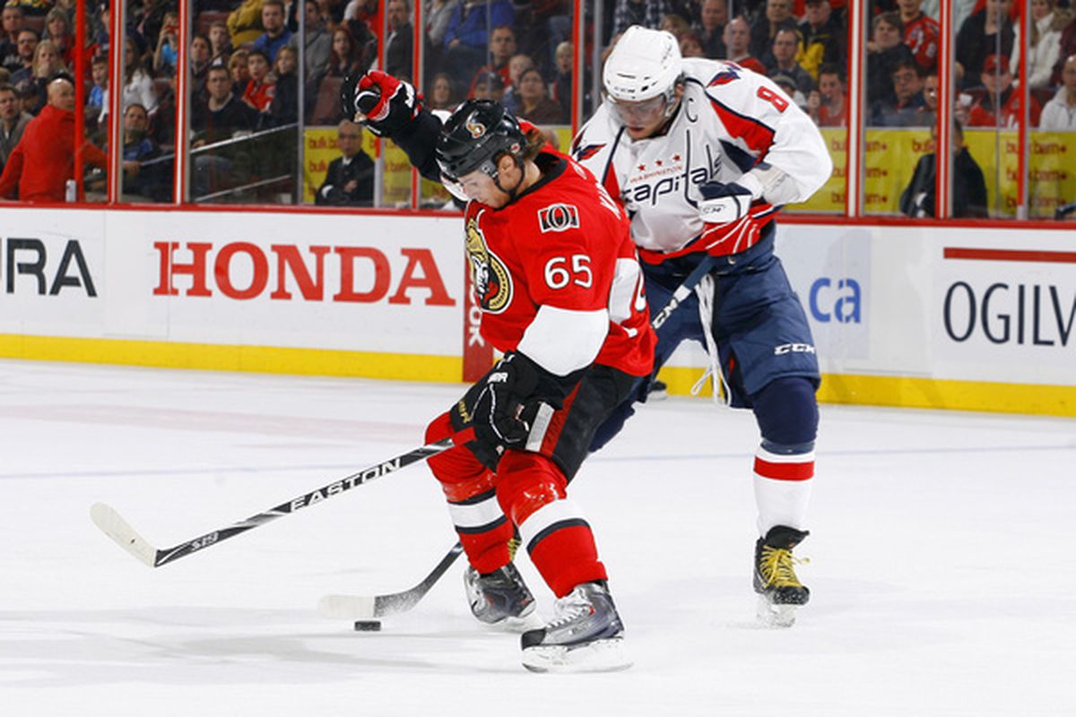 OTTAWA ON - DECEMBER 19:  Alex Ovechkin #8 of the Washington Capitals tries to deke around Erik Karlsson #65 of the Ottawa Senators in a game at Scotiabank Place on December 19 2010 in Ottawa Canada.  (Photo by Phillip MacCallum/Getty Images)