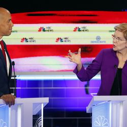 Democratic presidential candidate Sen. Elizabeth Warren, D-Mass., gestures towards New Jersey Sen. Cory Booker during a Democratic primary debate hosted by NBC News at the Adrienne Arsht Center for the Performing Arts, Wednesday, June 26, 2019, in Miami.