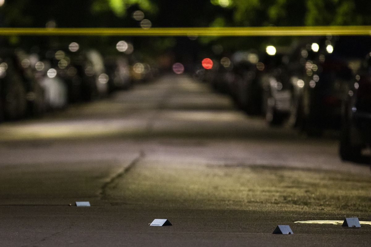 Chicago police investigate in the 7300 block of North Rogers Avenue in Rogers Park, where police said a 28-year-old man was shot multiple times Sunday night.