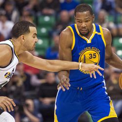 Utah forward Trey Lyles (41) applies pressure to Golden State forward Kevin Durant (35) during the second half of an NBA basketball game in Salt Lake City on Thursday, Dec. 8, 2016. Golden State defeated Utah with a final score of 106-99.