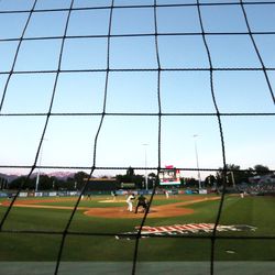 Protective netting helps to keep fans safe as they enjoy a Salt Lake Bees baseball game at Smith's Ballpark in Salt Lake City on Wednesday, June 5, 2019.
