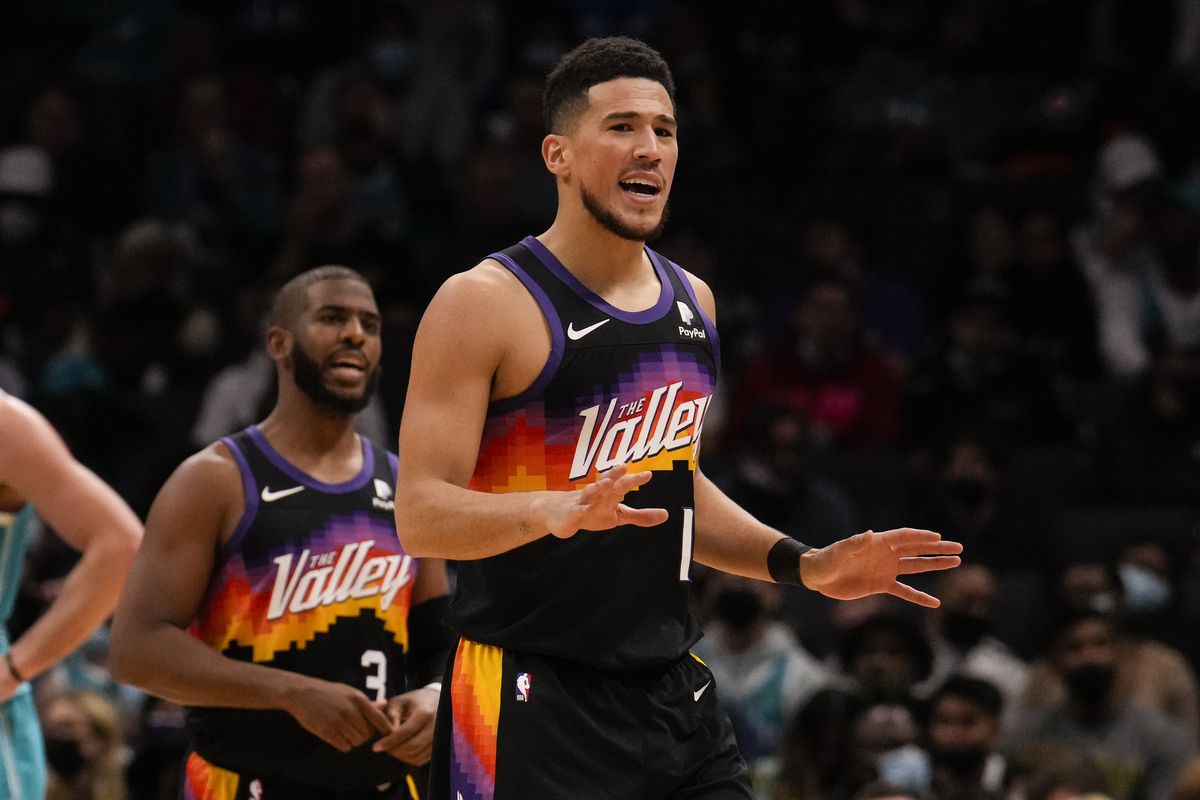 Phoenix Suns guard Devin Booker (1) looks to his bench as he reacts to a foul call during the second half against the Charlotte Hornets at the Spectrum Center.