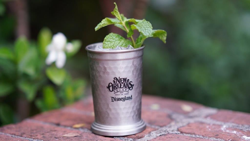 A mint julep with lots of ice in a chilled silver mug.