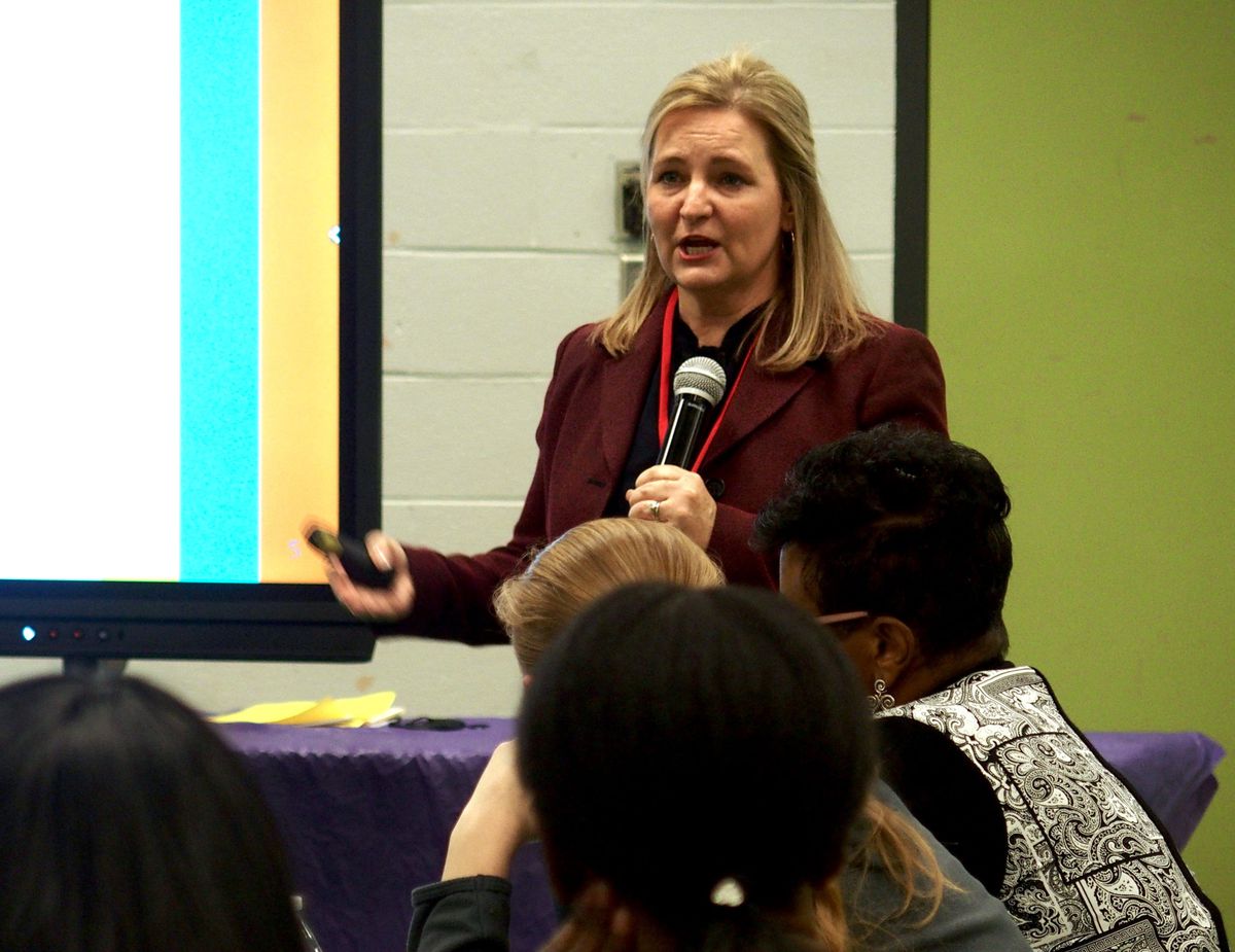 Eve Carney, the chief districts and schools officer for the Tennessee Department of Education, speaks at a community meeting in Memphis.