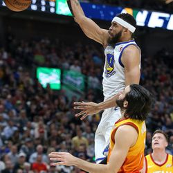 Golden State Warriors center JaVale McGee (1) dunks over Utah Jazz guard Ricky Rubio (3) at Vivint Arena in Salt Lake City on Tuesday, Jan. 30, 2018.