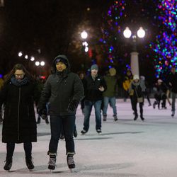 People ice skate around the McCormick Tribune Plaza ice rink in Millennium Park in the Loop. | Tyler LaRiviere/Sun-Times