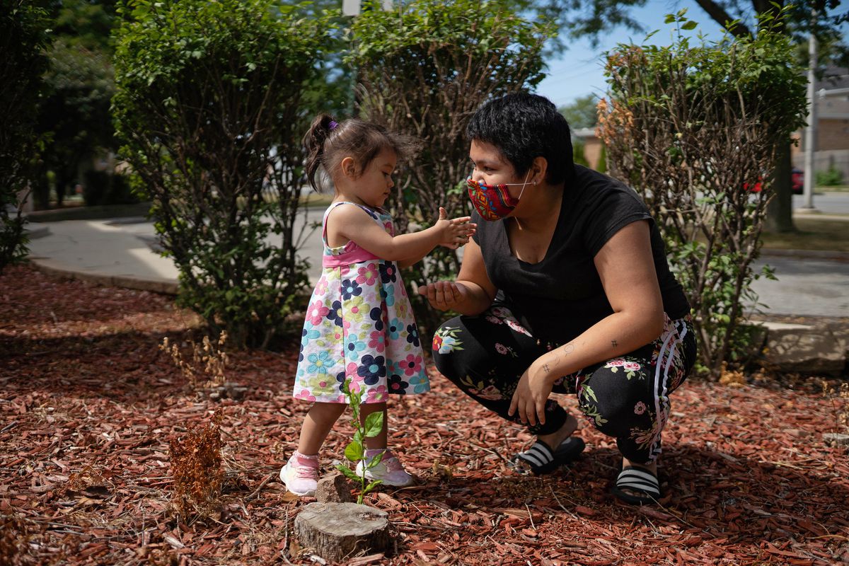Xochitl, 2, gives a leaf to Katsumi “Kitty” Perez, 19, at Warren Park Wednesday afternoon, Sept. 2, 2020.