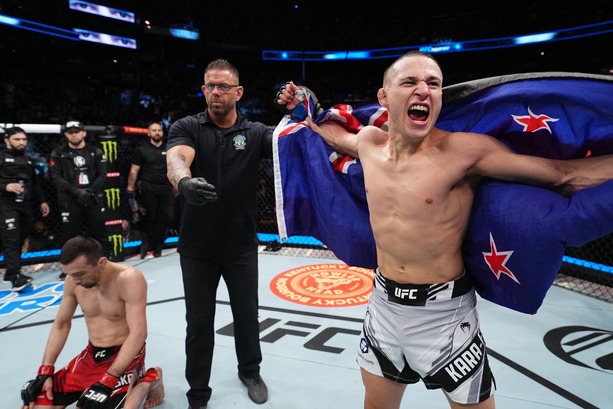 (R-L) Kai Kara-France of New Zealand celebrates his victory over Askar Askarov of Russia in a flyweight fight during the UFC Fight Night event at Nationwide Arena on March 26, 2022 in Columbus, Ohio.