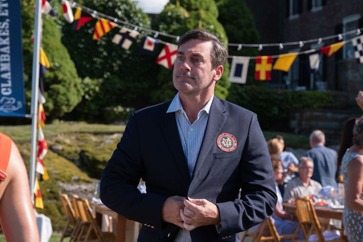 Jon Hamm looks rather shabby in a yacht club blazer at an outdoor party in Confess, Fletch