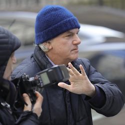 Gregory Abbott, founder and chairman of International Dispensing Corporation, leaves after appearing in federal court in New York on bribery charges, Tuesday, March 12, 2019. Abbott is among dozens of people who were charged Tuesday in a scheme in which wealthy parents allegedly bribed college coaches and other insiders to get their children into some of the nation's most elite schools. (AP Photo/Bebeto Matthews)