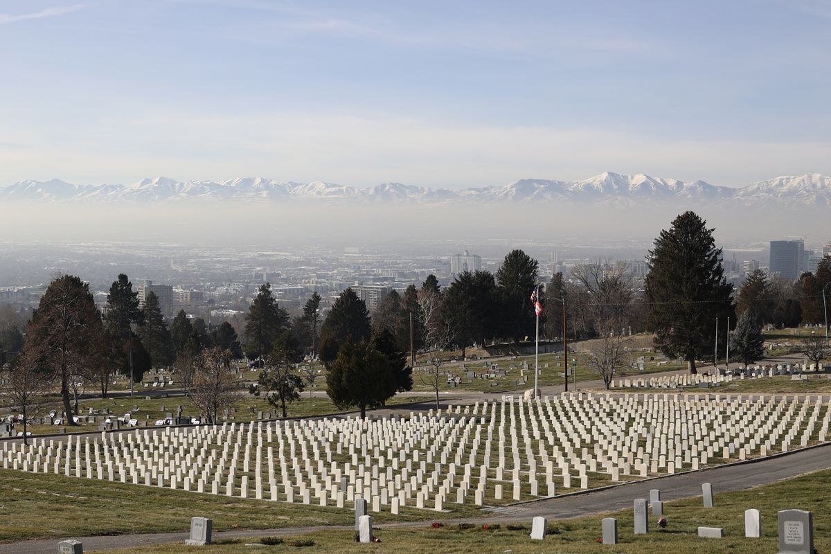 Smog settles over the Salt Lake Valley during an inversion as seen from the Salt Lake City Cemetery in Salt Lake City on Wednesday, Jan. 12, 2022. HB109, sponsored by Rep. Steve Handy, R-Layton, would allow physicians to indicate that poor air quality contributed to an individual’s death on the death certificate.