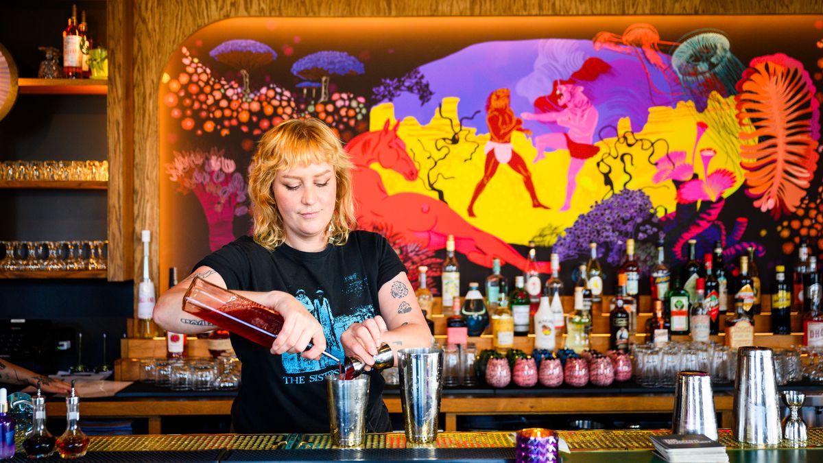 A bartender mixes a drink at the Houston Blacklight.
