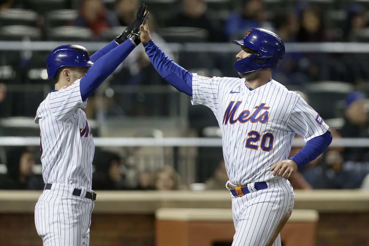 Pete Alonso of the New York Mets celebrates his run during the sixth inning against the Washington Nationals with teammate Mark Canha at Citi Field on April 27, 2023 in New York City.