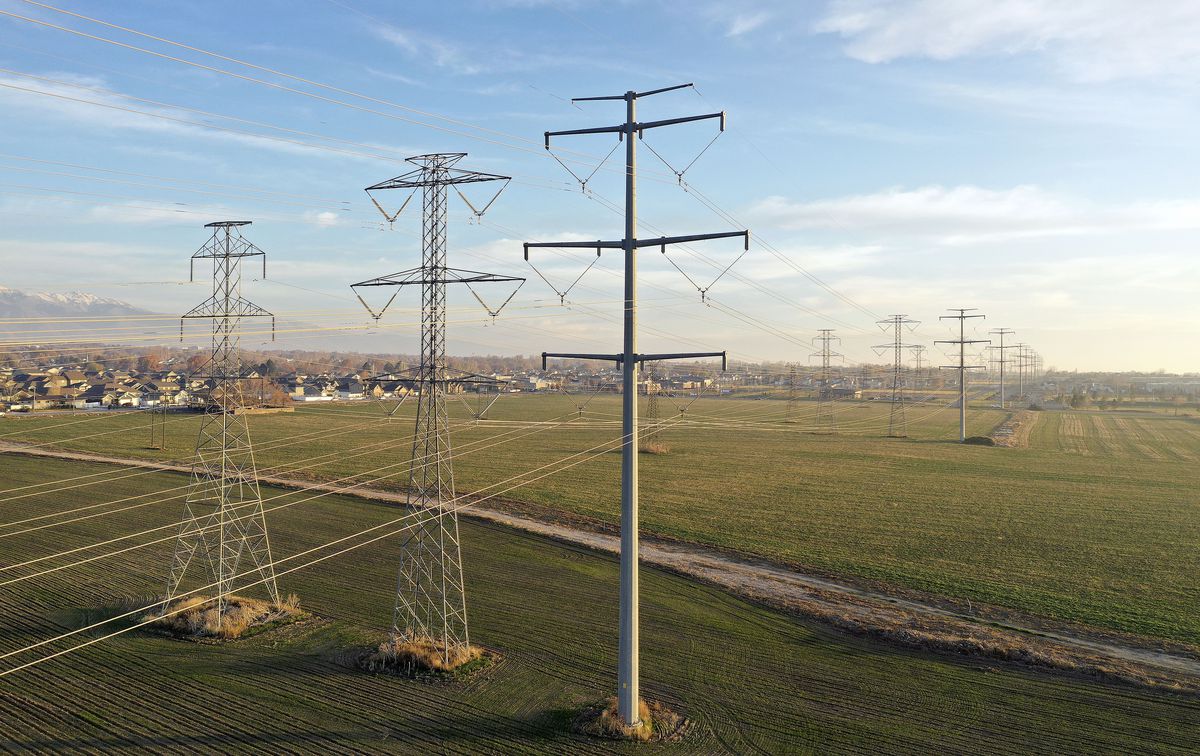 Power lines run through Roy on Tuesday, November 30, 2021.