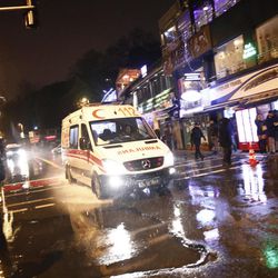 An ambulance rushes from the scene of an attack in Istanbul, early Sunday, Jan. 1, 2017. Turkey's state-run news agency said an armed assailant has opened fire at a nightclub in Istanbul during New Year's celebrations. 