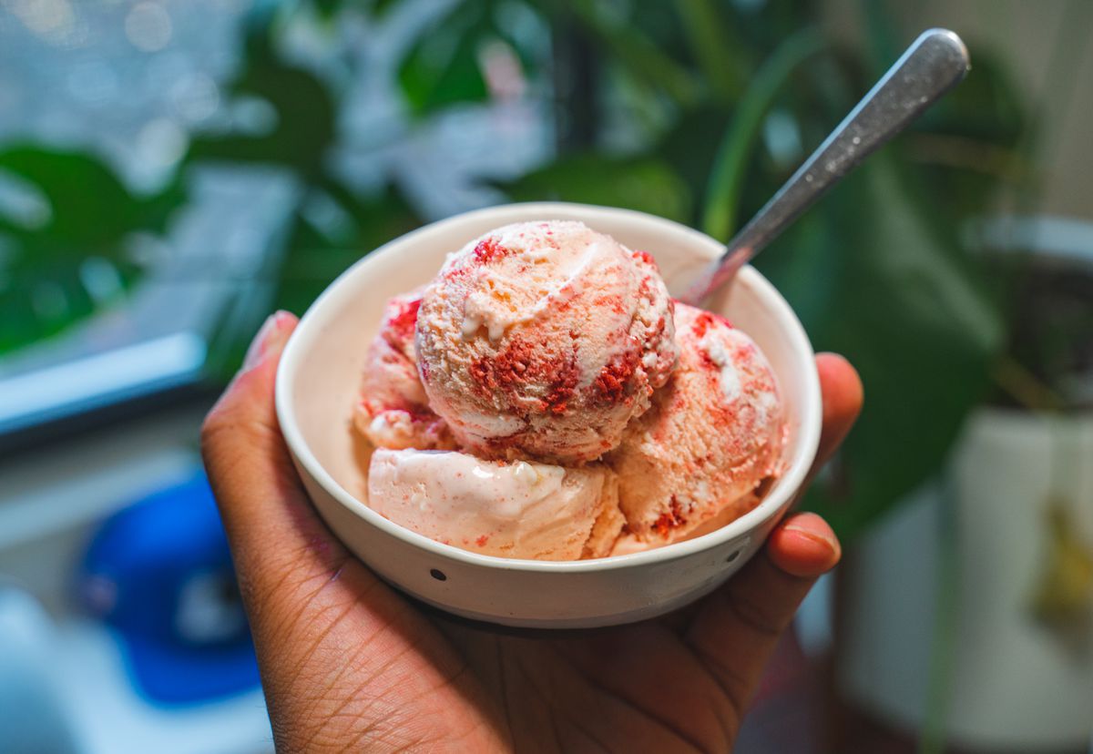 A bowl of red and white ice cream.