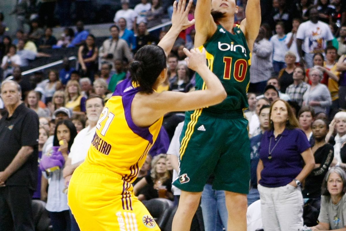 Los Angeles Sparks veteran Ticha Penicheiro has been a model of point guard "purity" during her career, but we can probably forgive Seattle Storm point guard Sue Bird for her more "impure" tendencies. <em>Photo by Craig Bennett/112575 Media.</em>