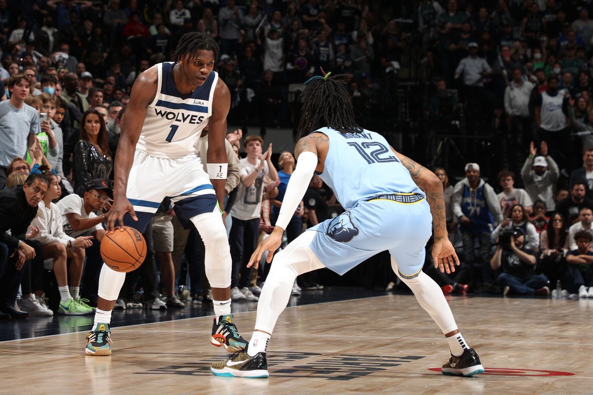 Ja Morant #12 of the Memphis Grizzlies plays defense on Anthony Edwards #1 of the Minnesota Timberwolves during Round 1 Game 4 of the 2022 NBA Playoffs on April 23, 2022 at Target Center in Minneapolis, Minnesota.