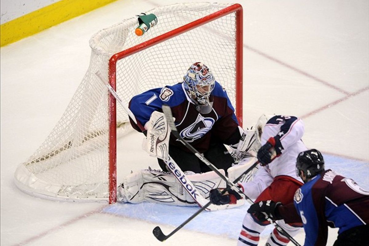 March 1 2012; Denver, CO, USA; Colorado Avalanche goalie Semyon Varlamov (1) defends a shot attempt by Columbus Blue Jackets right wing Cam Atkinson (13) during the second period at the Pepsi Center. Mandatory Credit: Ron Chenoy-US PRESSWIRE