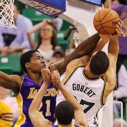 Utah Jazz center Rudy Gobert (27) is fouled by Los Angeles Lakers forward Ed Davis (21) as the Jazz and the Lakers play Wednesday, Feb. 25, 2015, at EnergySolutions Arena in Salt Lake City.