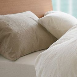 <b>Muji</b> washed cotton bedding, from <a href="http://www.muji.us/store/home-fabrics/bedding/washed-cotton-pillow-cover.html">$9.50</a>