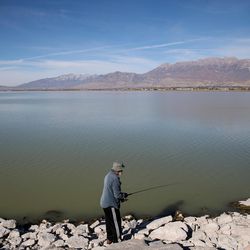 Levon Khachaturian, who's been finishing in Utah Lake since immigrating from Georgia 27 years ago, tries his luck at Utah Lake State Park in Provo on Thursday, Oct. 20, 2016.