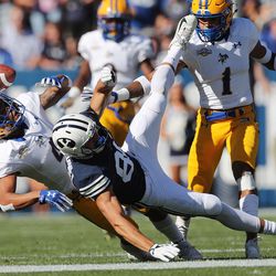Brigham Young Cougars wide receiver Gunner Romney (80) and McNeese State Cowboys defensive back Colby Burton (4) compete for the ball in Provo on Saturday, Sept. 22, 2018.