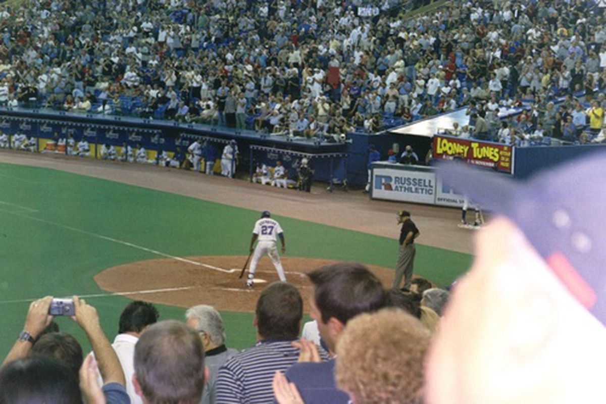 "Sign Adam Dunn!" the 2003 version. Montreal Expos fans salute their big middle-of-the-order-bat Vladimir Guerrero in his last at bat in front of the hometown Olympic Stadium fans.