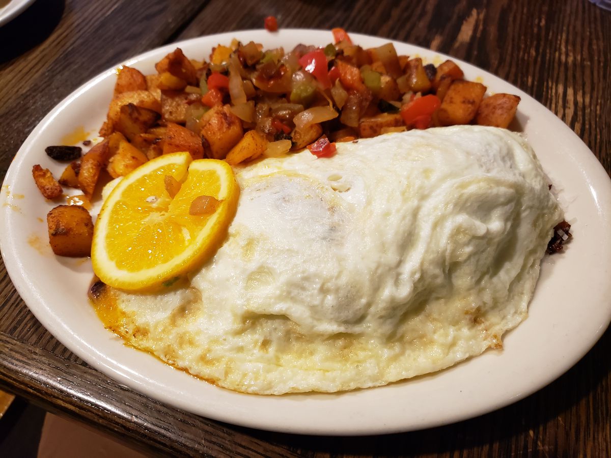 Tea’s omelette at Eggplantation with orange slice and fried potatoes.